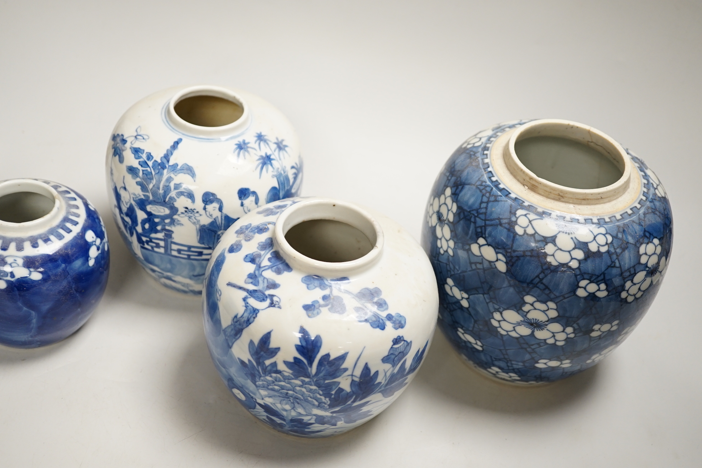 An 18th century Chinese blue and white Prunus jar and three 19th century Chinese blue and white jars, tallest 16cm